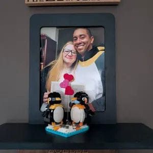 Nerd Hero frame with an 8x10 photo and a LEGO penguin build resting on the shelf