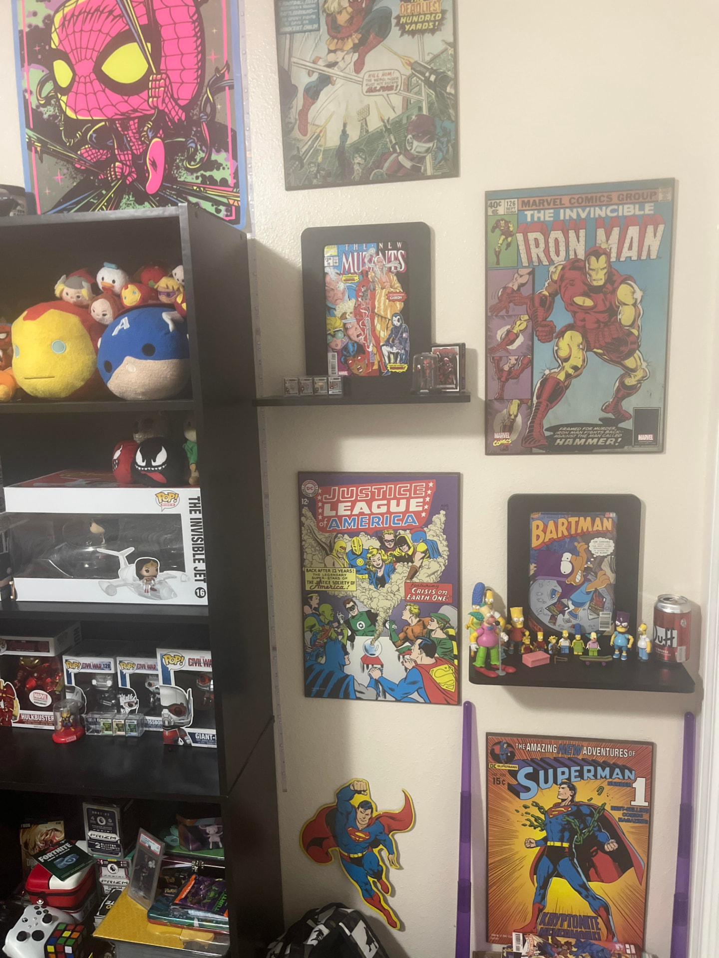 Comics, collectibles, and figures displayed on the actual Nerd Shelf
